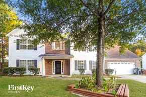 Buford house for rent - a white house with a large tree in a front yard