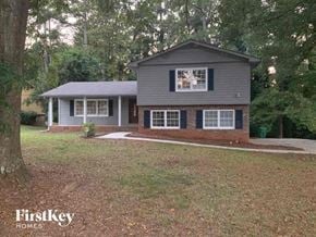 Lithonia house for rent - a small house with a yard and some trees