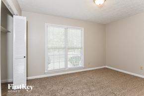 Marietta house for rent - a bedroom with a large window and a white closet