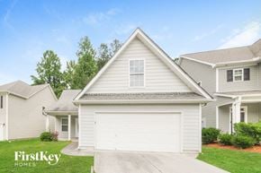 Dallas house for rent - a white house with a white garage door