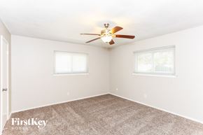 Duncanville house for rent - a bedroom with carpet and a ceiling fan