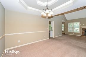 Powder Springs house for rent - the living room and dining room are spacious and lighted by a ceiling fan