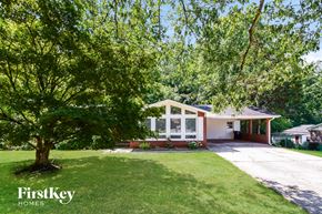 Dallas house for rent - a small white house with a tree in the yard