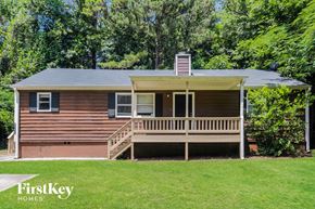 Marietta house for rent - a small house with a porch on a lawn
