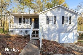 Hiram house for rent - a white house with a white deck and a white fence