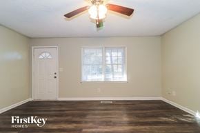 Hiram house for rent - the living room of an empty house with a ceiling fan