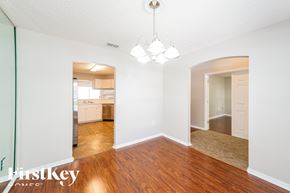 Lakeland house for rent - a renovated living room with wood flooring and a kitchen