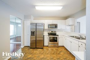 Lakeland house for rent - a renovated kitchen with stainless steel appliances and white cabinets