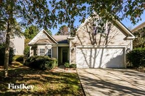 Charlotte house for rent - A house with a garage is shown in the image.