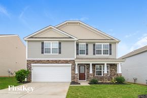 Whitsett house for rent - A two-story house with a garage is for sale.