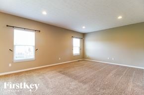 Morrow house for rent - A room with a carpeted floor and two windows.