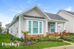 St Augustine house for rent - A house with a well-maintained lawn and garden in front.