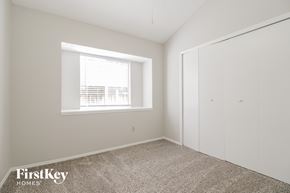 Oviedo house for rent - a bedroom with white walls and a window and a closet