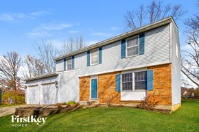Batavia house for rent - a white house with blue shutters and a lawn