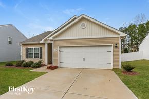 Charlotte house for rent - A two-car garage is attached to a house.
