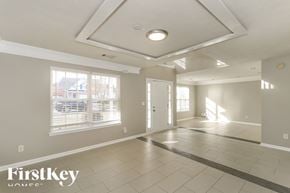 Dacula house for rent - A spacious room with a FirstKey Homes logo on the bottom left.