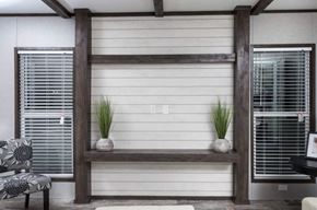 San Leon apartment for rent - a living room with a white wall and two shelves with plants