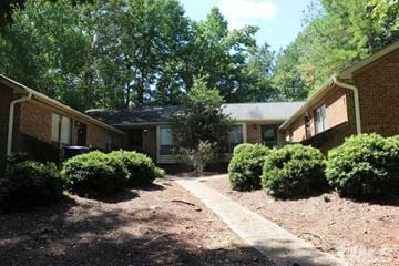 Raleigh apartment for rent - A residential area with houses and trees.