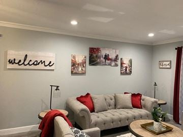 Bay City apartment for rent - a living room with couches and a table