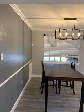 Bay City apartment for rent - a dining room with a table and a window