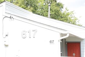 Birmingham apartment for rent - the front of a white house with a red door
