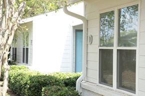 Birmingham apartment for rent - the front of a white house with a blue door