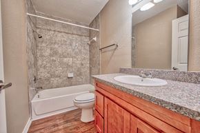 Port Arthur apartment for rent - a bathroom with a sink toilet and a shower