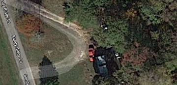 Girdletree house for rent - A car is parked on the side of a road.