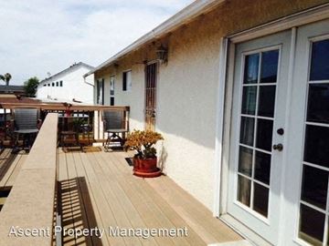 Imperial Beach apartment for rent - a house with a wooden deck and a door