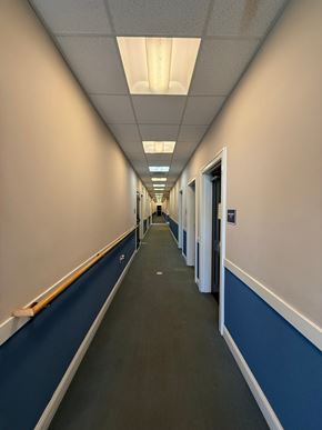 New Haven apartment for rent - A long hallway with doors on both sides.