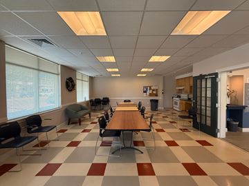 New Haven apartment for rent - A conference room with a long table and chairs.