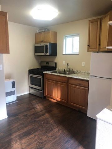 Kasilof house for rent - a kitchen with a stove microwave and a sink
