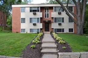 St. Louis Park apartment for rent - a sidewalk in front of a house with a tree