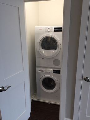 St. Louis Park apartment for rent - a front loading washer and dryer in a laundry room