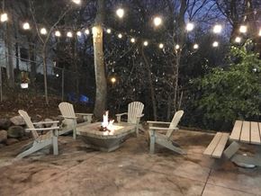 St. Louis Park apartment for rent - a patio with a fire pit and chairs and lights