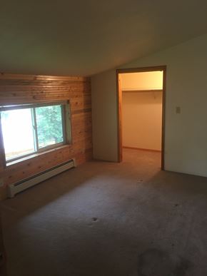 Soldotna apartment for rent - an empty living room with a window and a door