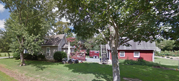 Temperanceville house for rent - A tree in front of a house.