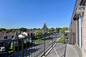 Brossard apartment for rent - a balcony with a view of a yard and a building