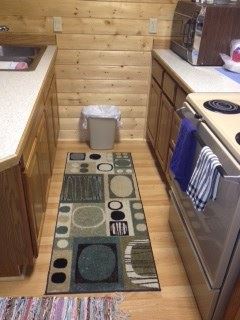 Sterling house for rent - A kitchen with a rug on the floor.