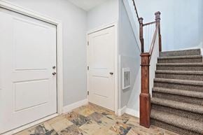 Detroit apartment for rent - the entrance to a house with stairs and a door next to a staircase