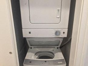 Detroit apartment for rent - a small bathroom with a toilet and a washing machine