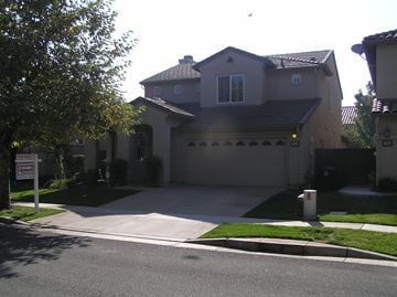 Rancho Cordova house for rent - the front of a house with a driveway and a garage door