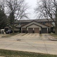 Rantoul apartment for rent - a house with a driveway and a garage door