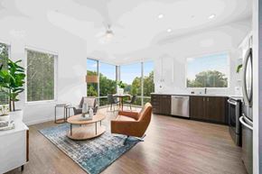 Sacramento apartment for rent - an open living room with a kitchen and a large window