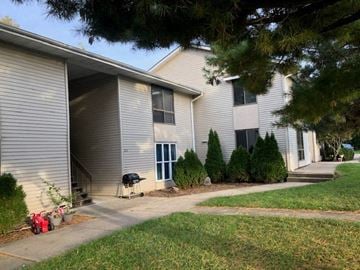 Rantoul apartment for rent - a white house with a sidewalk in front of it