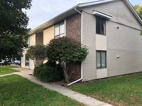 Rantoul apartment for rent - a white house with a sidewalk in front of it