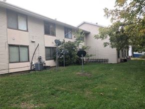 Rantoul apartment for rent - a house with a yard in front of it