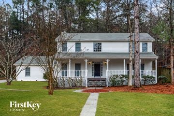 Snellville house for rent - a white house with a front porch and a lawn
