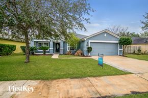 Jacksonville house for rent - A house with a blue garage door is for sale.