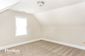 Charlotte house for rent - a bedroom with white walls and carpet and a window